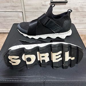 Woman’s Sorel black and white athletic shoe. Velcro strap.